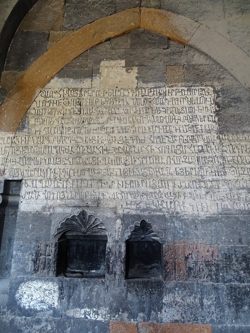 A wall covered with Armenian inscriptions at Hovhannavank Monastery above the Kasagh gorge near Yerevan. They are carved in the erkatagir majuscule, still the preferred hand for inscriptions.