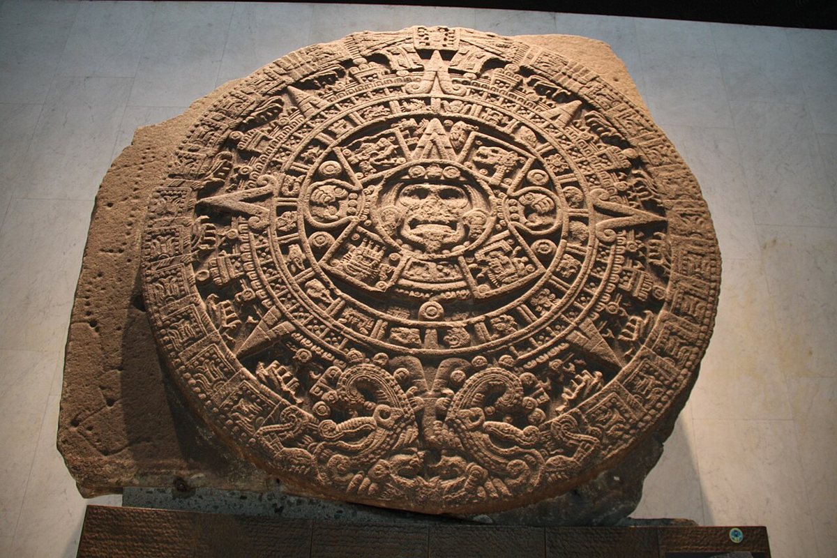 The Sun Stone (Piedra del Sol) in the National Museum of Anthropology, Mexico City. The disc is about 3.6 metres across; in the centre is a face, surrounded by the sign 4 Movement and a ring of the twenty day signs.