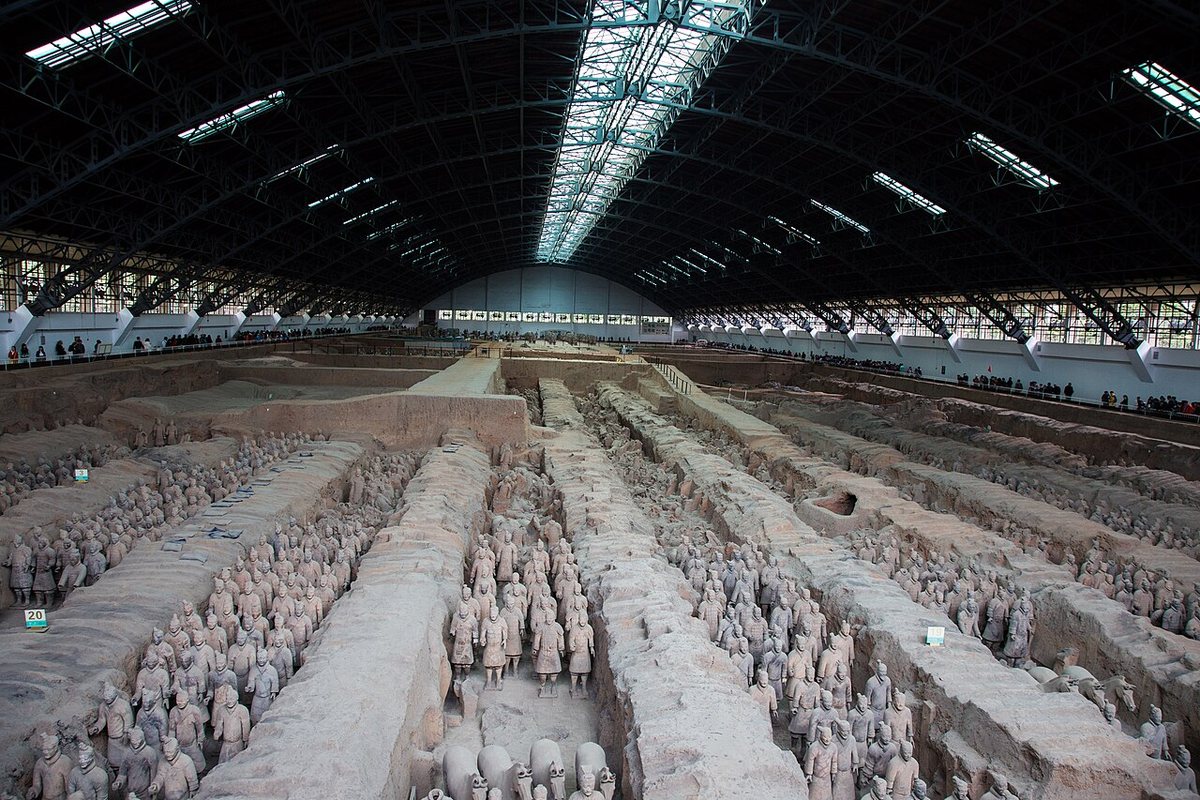 Pit 1 of the Terracotta Army in the mausoleum of the First Emperor, Qin Shi Huang, near Xi'an. The pit is 230 m long and 62 m wide and holds the main army of more than 6,000 figures.