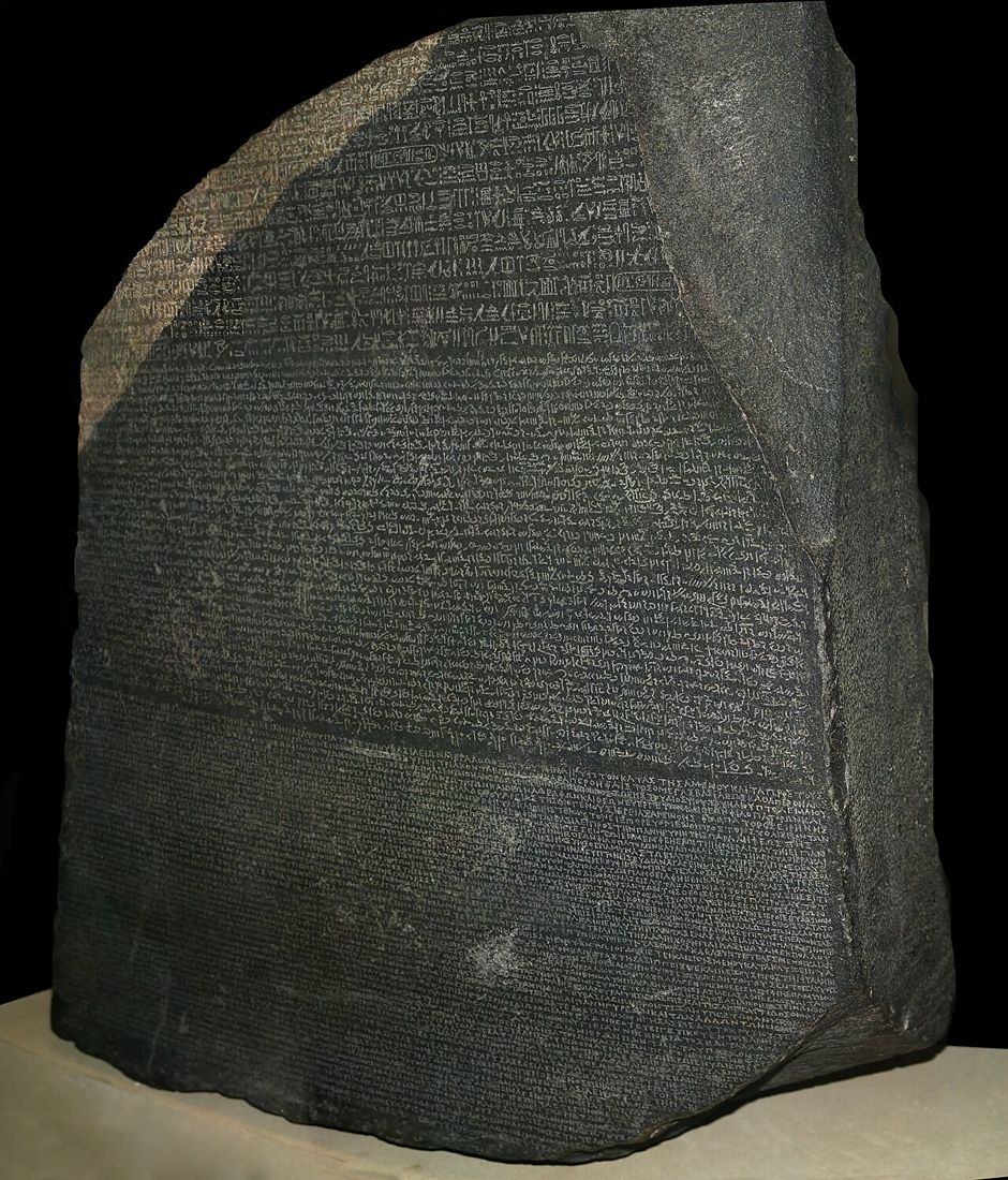 The Rosetta Stone (196 BCE): the same priestly decree in hieroglyphs, Demotic and Greek. British Museum, London.