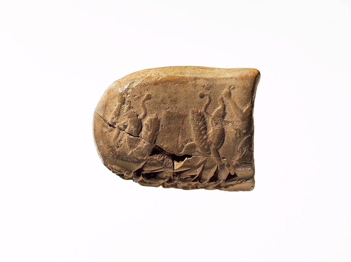 A clay tablet with seal impressions, an administrative record in Achaemenid Elamite. Metropolitan Museum of Art, New York.