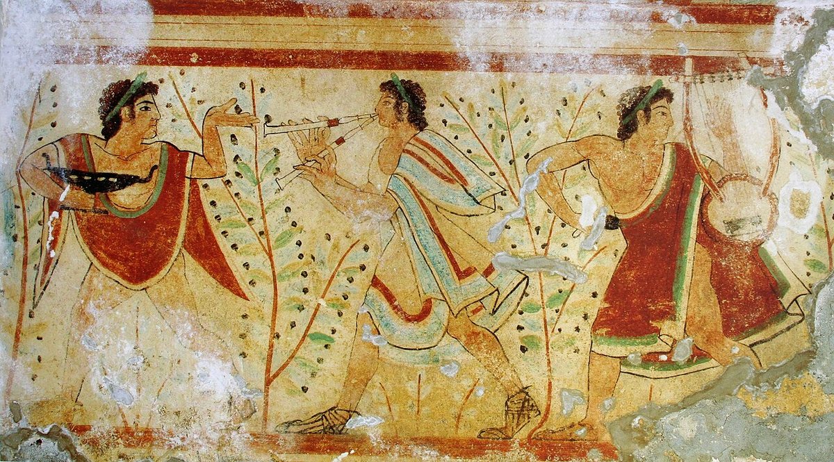 Dancers and musicians on a side wall of the Tomb of the Leopards at Tarquinia.