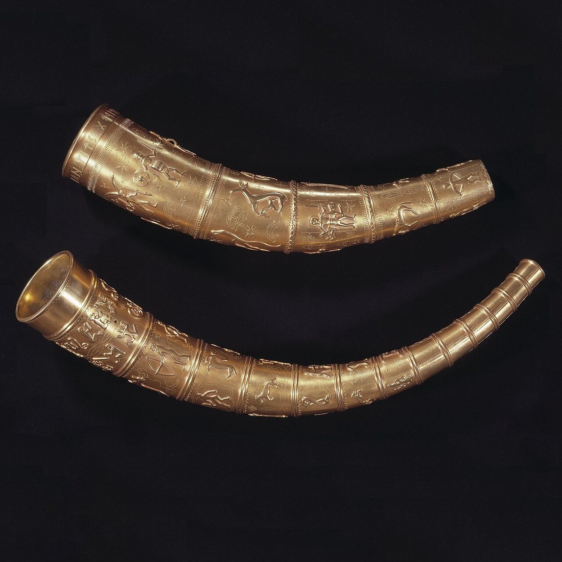 Replicas of the Golden Horns of Gallehus (southern Jutland, early 5th century), made in 1980 from 17th- and 18th-century drawings. The originals were stolen and melted down in 1802. The runic inscription runs round the mouth of the shorter horn (top). National Museum of Denmark, Copenhagen.