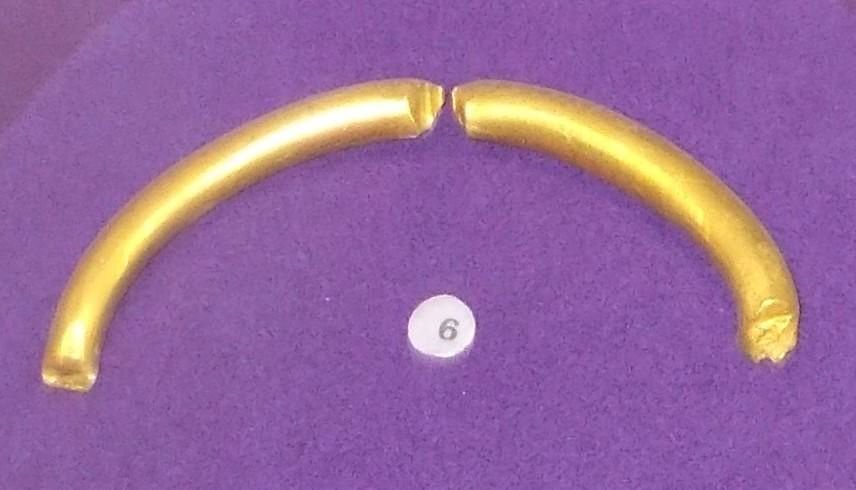 The gold neck-ring with a runic inscription from the Pietroasele treasure (Romania), c. 250–400. It was broken in two when it was stolen in the 19th century, and part of the inscription was damaged. National History Museum of Romania, Bucharest.
