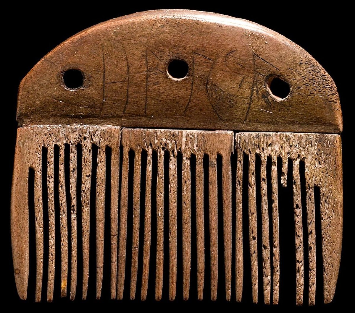 An antler comb from the Vimose bog on the island of Funen (Denmark), c. 150–200, inscribed in runes harja, most likely a man's name. It is among the oldest securely dated runic inscriptions. National Museum of Denmark.