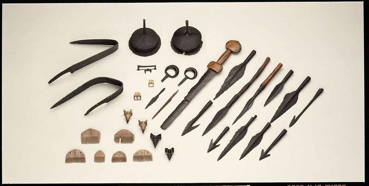 Weapons and personal equipment from Vimose on Funen. Weapons were deposited in the bog as offerings again and again during the Roman period; the comb with runes comes from the same site. National Museum of Denmark.