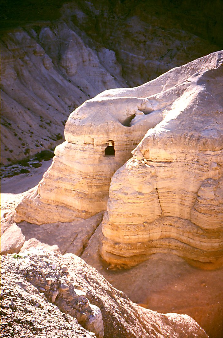 Cave 4 at Qumran (most probably), cut into a soft marl terrace above the Dead Sea; most of the manuscripts were found in it.