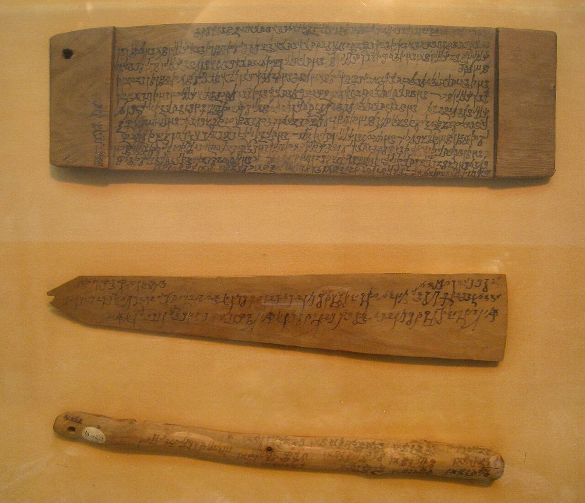 A wooden board, tablet and stick inscribed in Kharosthi from Niya in the Tarim Basin (Xinjiang), 3rd century CE; National Museum, New Delhi.