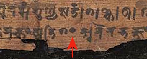 Detail of the Bakhshali manuscript: the dot marked by the arrow is the sign for zero.