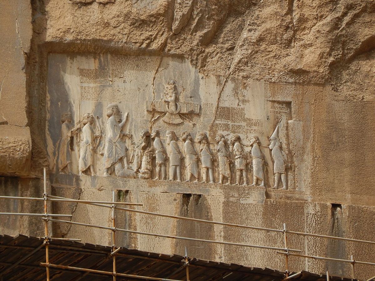 The Behistun inscription of the Persian king Darius I (c. 520 BCE) on a cliff in western Iran: the same text in Old Persian, Elamite and Babylonian.