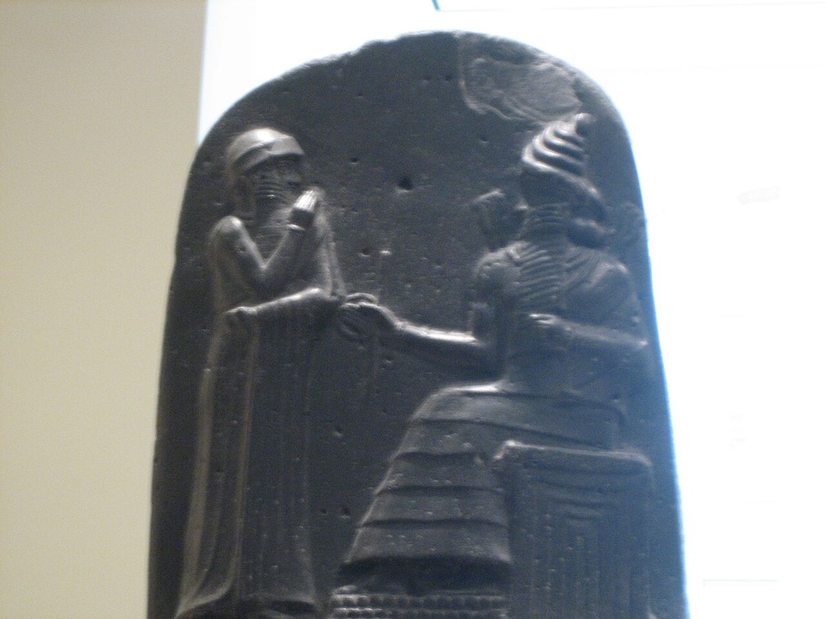 The top of the stele bearing the Code of Hammurabi (18th century BCE): the king stands before Shamash, god of the sun and justice. The text of the code continues below the relief, out of frame. Louvre, Paris.