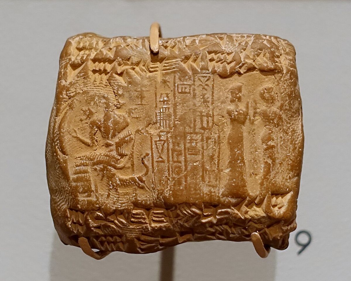 A cuneiform tablet in a clay envelope with cylinder-seal impressions (Ur III period, c. 2100–2000 BCE). Harvard Semitic Museum.