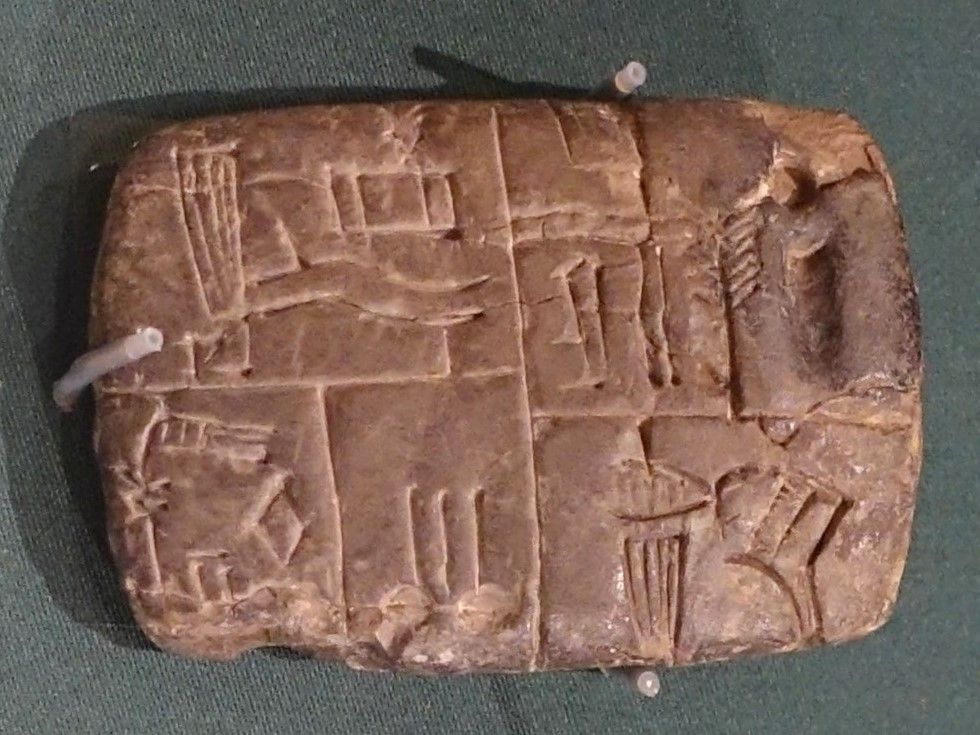 A proto-cuneiform accounting tablet from the Jemdet Nasr period (c. 3200–3000 BCE) from Tell Asmar. The pictorial signs were still drawn into the clay with a point. Oriental Institute, Chicago.
