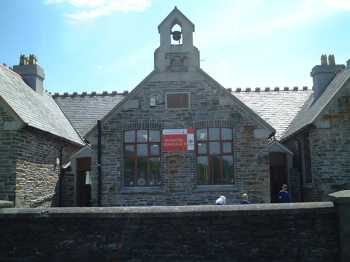 The Bunscoill Ghaelgagh, a Manx-medium primary school in St John's on the Isle of Man. The school's name is on the board on the façade.
