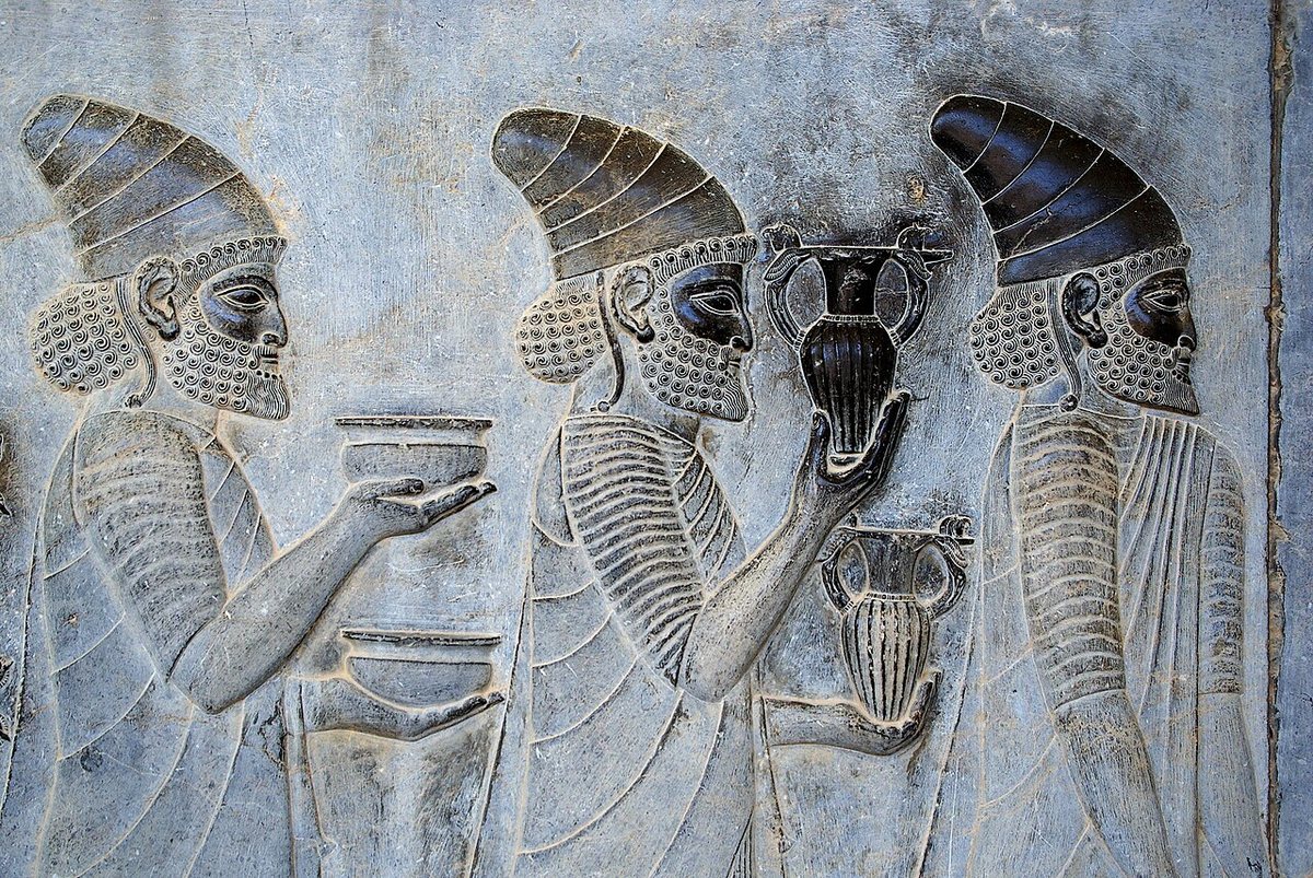 Relief on the eastern stairway of the Apadana, the audience hall at Persepolis: delegations of the subject lands bring gifts to the king, here vessels and bowls. The Apadana was begun by Darius I and completed by Xerxes I.