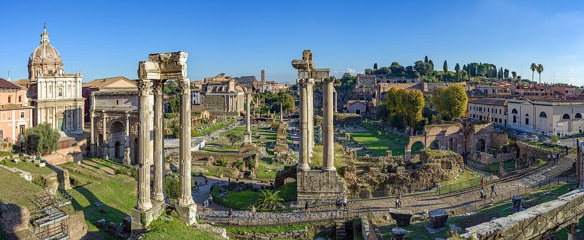 The Forum Romanum in Rome, seen from the Capitoline Museums. In its north-western part, on the site of the oldest assembly place (the Comitium), a stone block bearing one of the earliest Latin inscriptions lies beneath the black marble paving called the Lapis Niger.