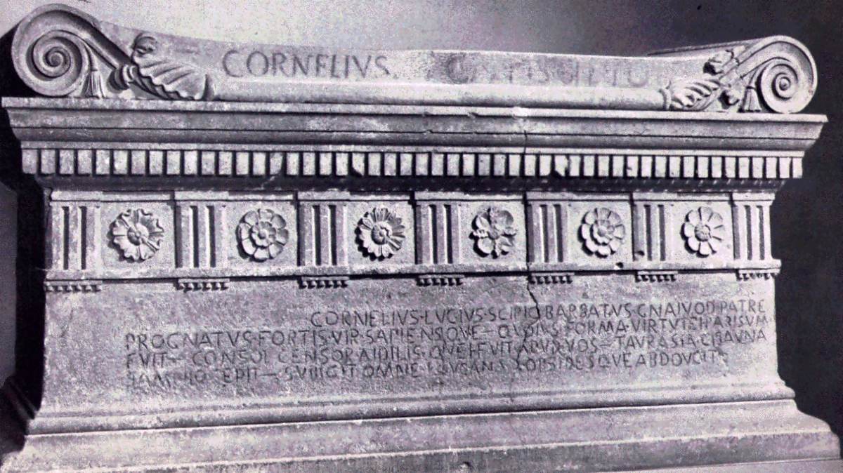 The sarcophagus of Lucius Cornelius Scipio Barbatus, consul in 298 BCE, from the Tomb of the Scipios on the Via Appia, now in the Vatican Museums. The lid bears the name CORNELIVS; the front carries a verse epitaph in Old Latin.