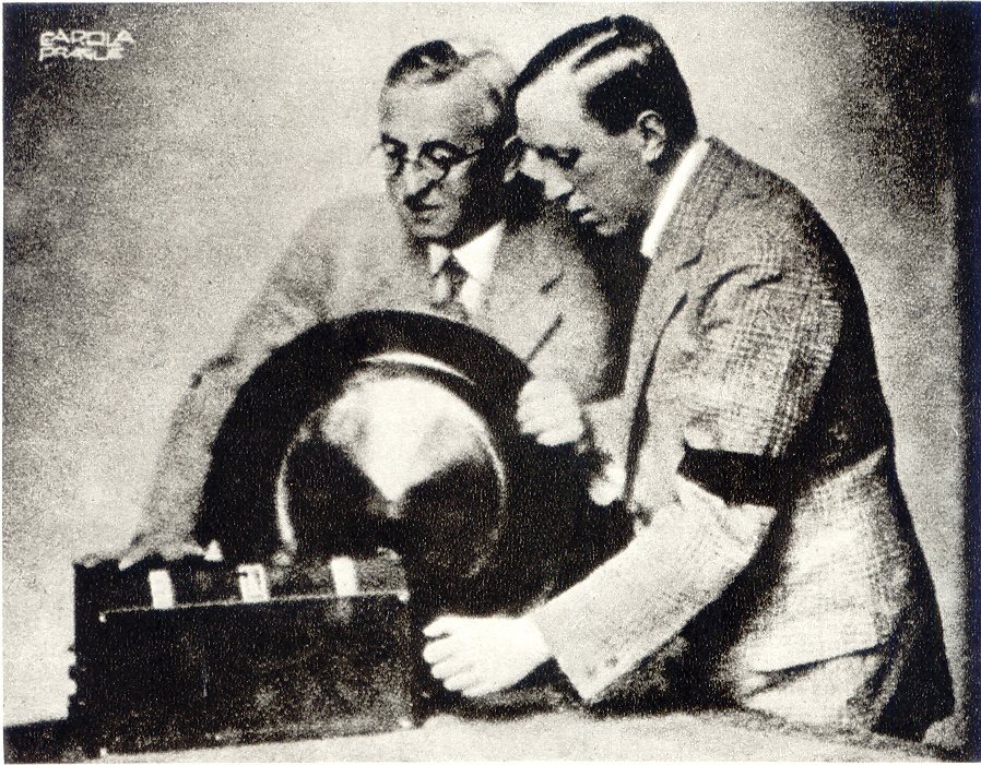 Josef Čapek (left, with glasses) and Karel Čapek at a radio set.