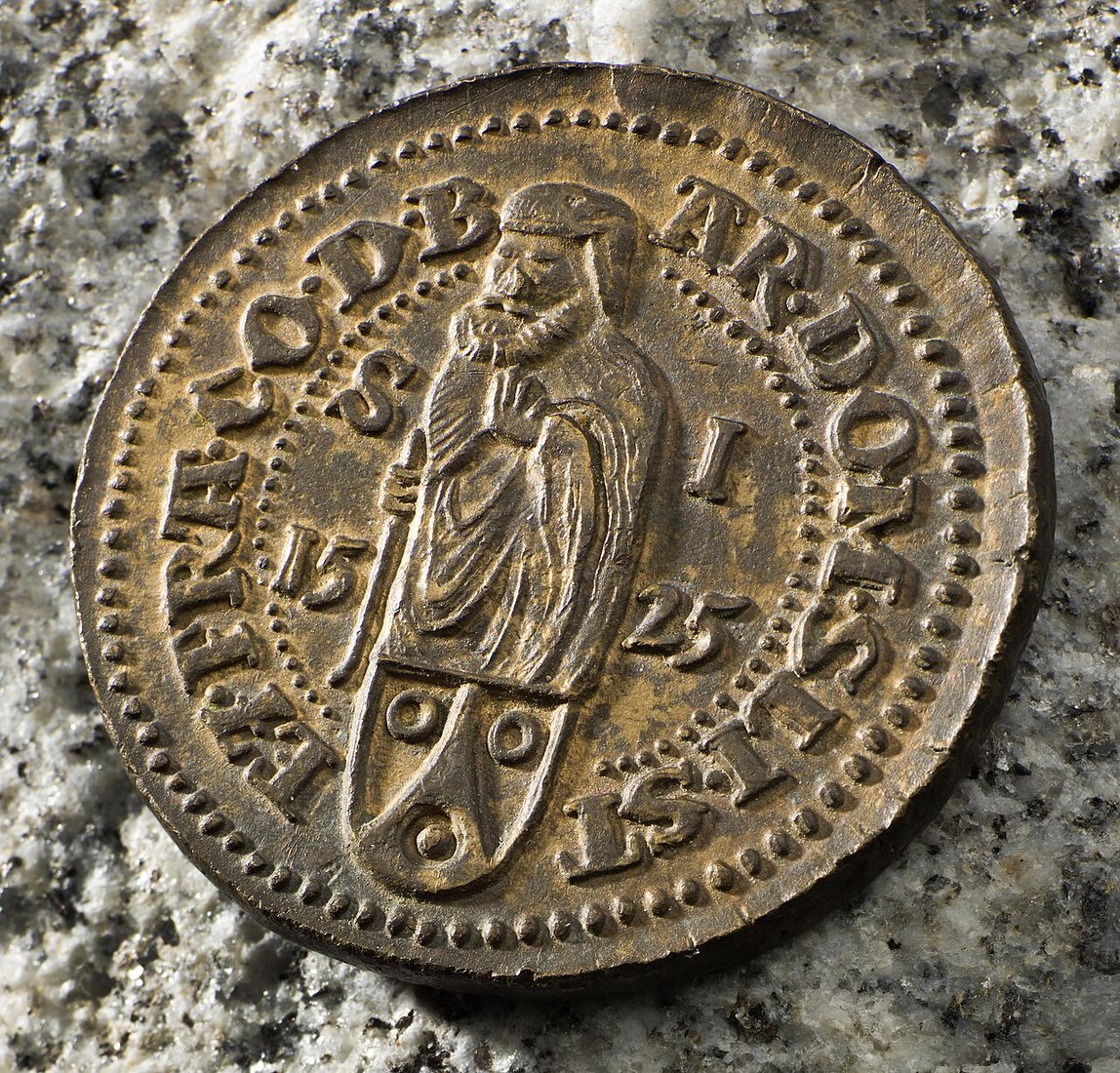 The other side of the same coin: Saint Joachim above the arms of the Schlick family, with the date 1525.